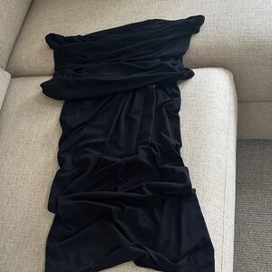 Donna Karan Elegant Black top, off the shoulder twist at hip waist.